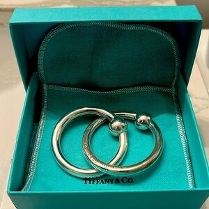 An authentic Tiffany & Co. sterling silver double ring baby rattle.